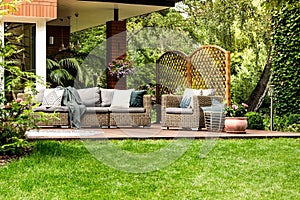 Veranda surrounded by green grass