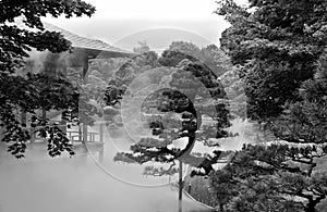 Veranda of a traditional Japanese house in the garden in the fog in monochrome