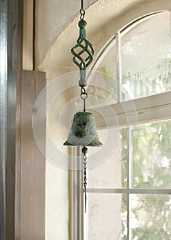 Verdigris Bell Near Window photo
