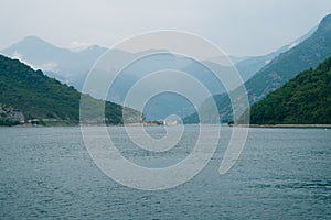 Verige Strait in Kotor Bay, Montenegro, against the backdrop of the city of Perast.