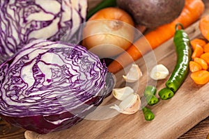 Verious fresh vegetables on a wooden table, healthy food