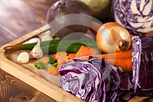 Verious fresh vegetables on a wooden table, healthy food