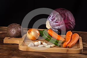 Verious fresh vegetables on a wooden table, healthy food