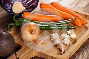 Verious fresh vegetables on a wooden table, healthy food