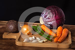 Verious fresh vegetables on a wooden table, healthy food