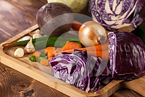 Verious fresh vegetables on a wooden table, healthy food