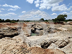 Vermiculite mining area on a beautiful sunny day with clouds