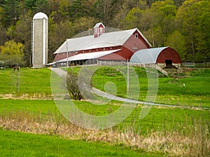 Vermont Farm Scene with red barn silo fields horse