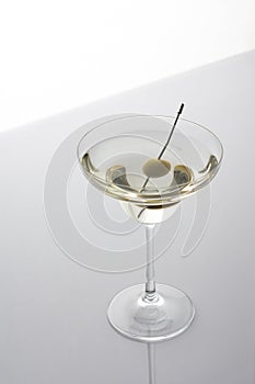 Vermouth in a cocktail glass with olives