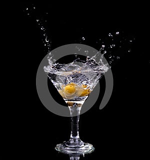 Vermouth cocktail inside martini glass over dark