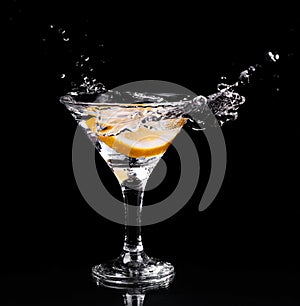 Vermouth cocktail inside martini glass over dark background