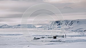 Vernadsky Antarctic station at white snow, ice landscape on island. Antarctica expedition