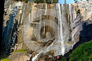 Vernal Falls yosemite national park with a woman for scale.