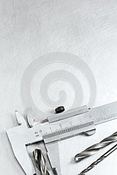 Vernier caliper on metal background