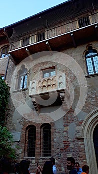 The famous House of Juliet with its balcony in a small courtyard in the city of Verona Italy is always full of tourists