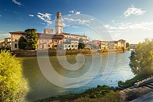 Verona cityscape during late sunset with Adige river and Church