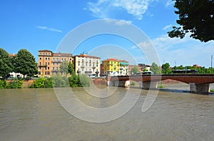 Verona cityscape view on the Adige riverside with historical buildings and towers on sunrise at