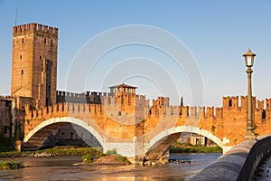 Verona, Italy. Castelvecchio bridge on Adige river. Old castle sightseeing at sunrise