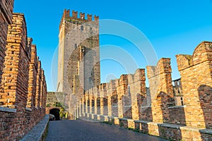 Verona, Italy. Castelvecchio bridge on Adige river. Old castle sightseeing at sunrise