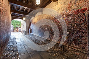 VERONA, ITALY- September 08, 2016: The wall full of messages on different foreign languages from lovers in Juliet house in Verona.