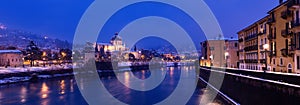 Verona at night with snow - Adige river Italy