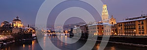 Verona at night with snow - Adige river Italy