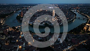 Verona skyline, aerial view of historical city centre at night evening, Italy