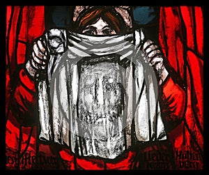 Veronica holding her veil, Dark sun of Good Friday, detail of stained glass window in St James church in Hohenberg, Germany
