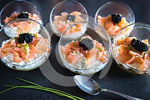 Verrine salmon lumpfish egg fresh cheese and avocado bed