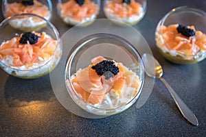 Verrine salmon lumpfish egg fresh cheese and avocado bed