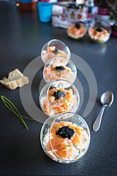 Verrine salmon lumpfish egg fresh cheese and avocado bed