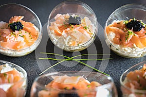 Verrine salmon lumpfish egg fresh cheese and avocado bed