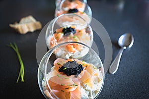 Verrine salmon lumpfish egg fresh cheese and avocado bed