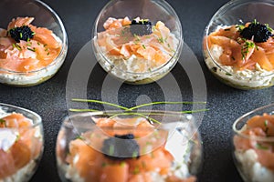 Verrine salmon lumpfish egg fresh cheese and avocado bed