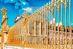 VERSAILLES, FRANCE - JULY 02, 2016 : Golden Gate of Chateau de Versailles with blue sky . Paris, France