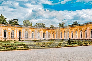 VERSAILLES, FRANCE - JULY 02, 2016 : Grand Trianon-little pink marble and porphyry palace with delightful gardens. Chateau de