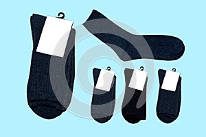 Versatile, new, warm socks on blue background.