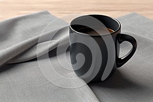 Versatile product mockup, black coffee mug on linen napkin Empty cup