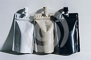 Versatile trio of colorful stand up pouches with matching caps for sleek packaging photo