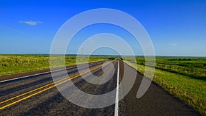 Empty West Texas Highway Under Blue Sky