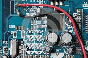 Version 3, Blue electronic circuit close-up.