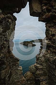 Vertical aerail of a the Skie island, Scotland captured between a rock crack photo