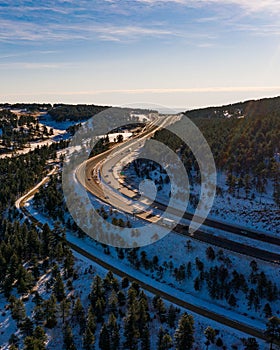 vertical aerial capture of large highway interstate 70 bend in colorado just outside of denver