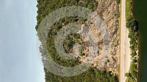 Vertical aerial drone video inspection mountain with mesh net to catch falling rocks and landslides