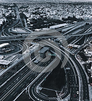 Vertical aerial view of an empty intersection with crossing roads in Attiki Odos, Athens, Greece photo