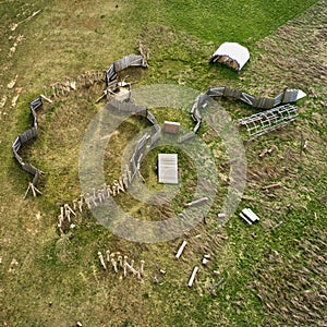 Vertical aerial view of a near-natural adventure playground, which is modelled on an archaeological excavation site