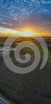 Vertical Aerial View of Sunset over Agricultural Fields
