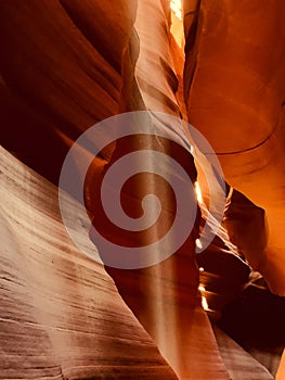Vertical amazing shot of an inside  view of  Antelope Canyon with sandstones and sunlight in