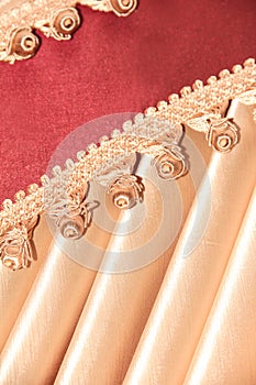 Vertical background with beige, Burgundy with tassels