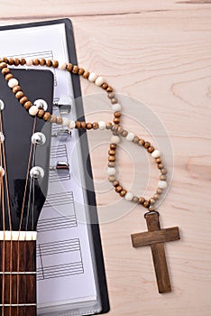 Vertical background detail of religious music with guitar top